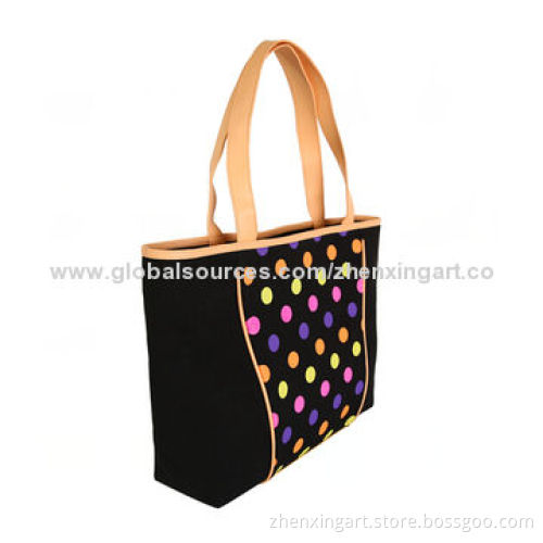 Black canvas handbag with colorful dots
